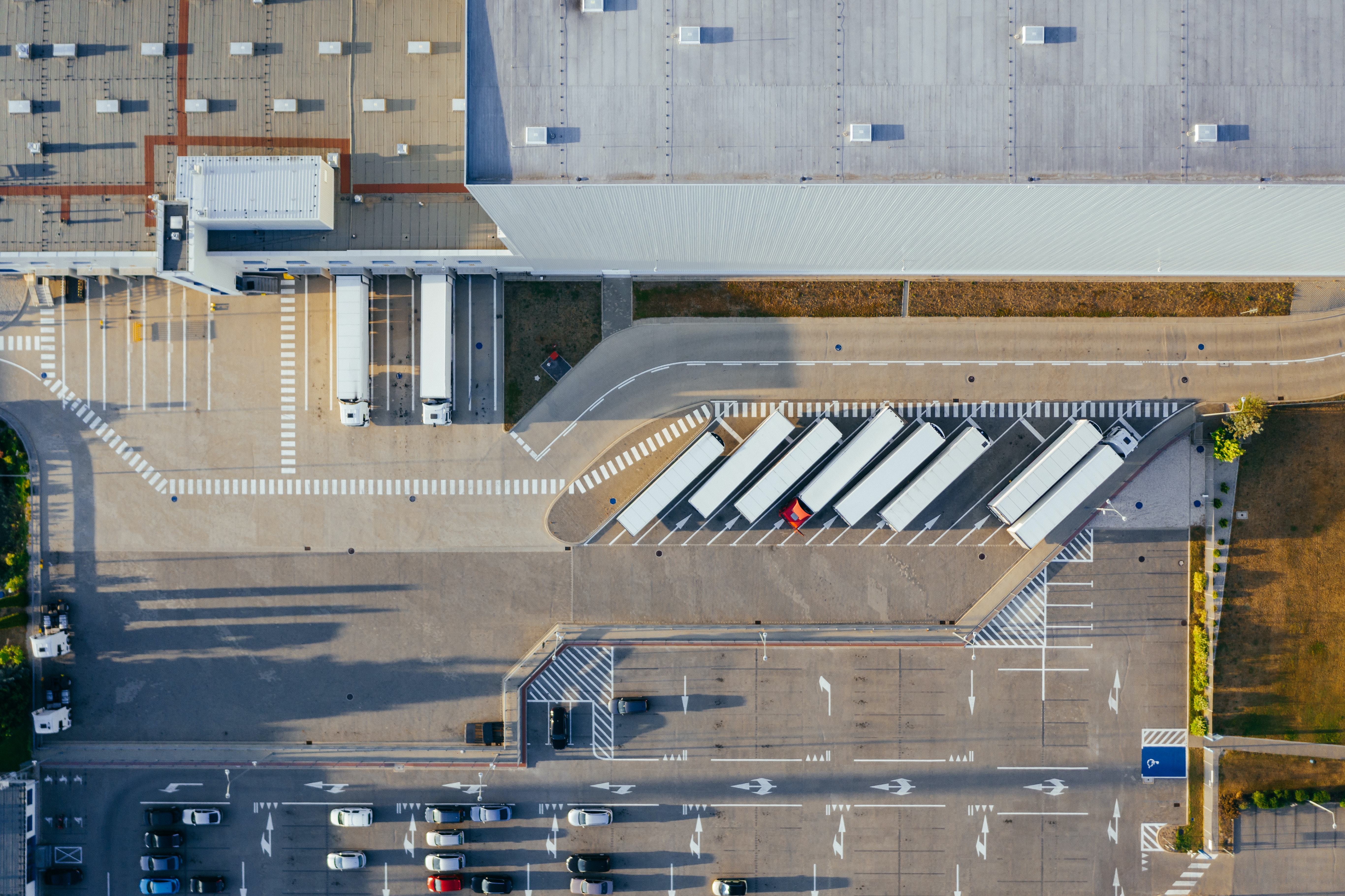 aerial view of trucks being loaded from a storage depot