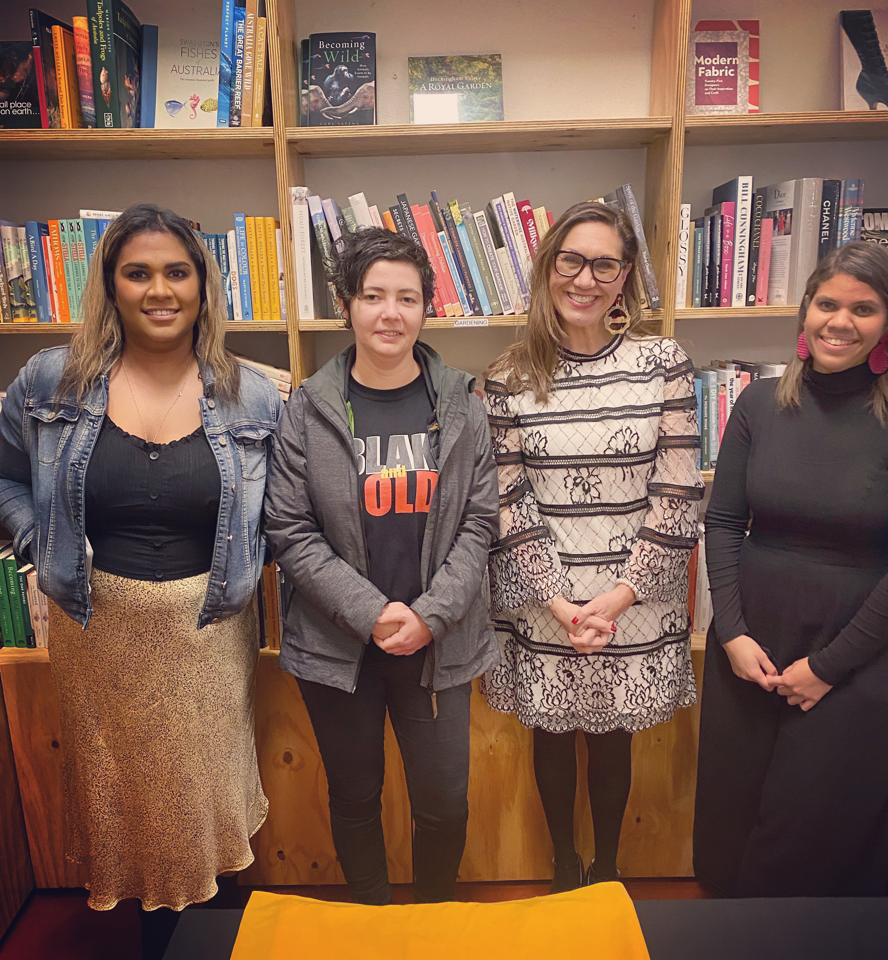  Four women pose in front of a bookshelf at Avid Reader: Lauren Bandit, Grace Lucas Pennington, Anita Heiss and Yasmin Smith.